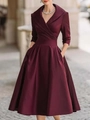Detail of elegant V-neck wine red satin dress featuring a high waist and 3/4 sleeves - S / Dresses / Burgundy
