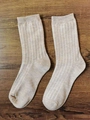 Japanese style light khaki crew socks with white vertical stripes on wood background - Buckwheat