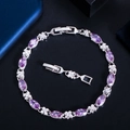 Detail of silver bracelet with purple marquise gemstones and zircon flower accents - Purple