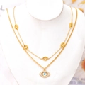 Double-layer gold evil eye necklace with blue rhinestone pendant and hollow charms - Necklace