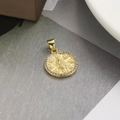 Detailed close-up of golden Virgin Mary pendant with pearls and sparkling zircon stones - Pearl Border Round