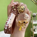 Acrylic liquid keyring with brown silicone strap and floating bear milk tea charm - Lollipop + Silicone Strap Style