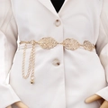 Elegant gold hollow leaf metal waist chain belt with tassel drapes on a white blazer - Gold