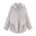 Detail of striped long sleeve shirt showing button closure and irregular layered hemline - XS / Brown White Stripe