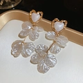 Macro detail of French style heart studs with layered white acrylic petal tassels - Silver Needle Heart Petal Style / White