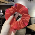 Luminous bright red satin scrunchie held by hand featuring soft glowing LED light effect - Red / 3 Light Modes