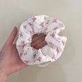 Hand holding a large white double-layer lace scrunchie with pink abstract animal patterns - Q617-4 White Pink Abstract Print