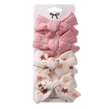 Detail of 4-piece bow hair clip set with floral patterns on a display card - Pink & Beige Floral