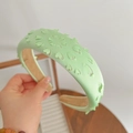 Mint green wide headband featuring cutout cherry blossom design and sponge volume boost - Grass Green