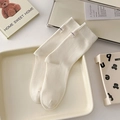 Creamy white ribbed mid-calf cotton socks with minimalist cloth tag in Korean style - One Size / Cream