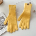 Detail of yellow knit gloves with ribbed texture and small brown leather label - One Size / Light Yellow