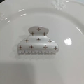 Detail of pearl white hair claw clip with pink floral rhinestones on white ceramic tray - Pearl White Champagne Diamond