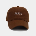 Detailed close-up of white PARIS embroidery on a dark brown cotton baseball cap - Coffee
