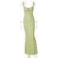 Detail view of yellow floral sundress with blue patterns and front tie design - S / Yellow