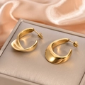 Detail of twisted 18K gold geometric earrings resting on a silver jewelry box - Twisted Geometric C-Shape Chunky Earrings / 925 Silver Needle