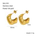 Close-up of chunky gold C-shape titanium steel earrings with 18K gold plated finish - Gold