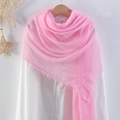 Lightweight pink pleated cotton linen scarf with frayed edges on a wooden hanger - Pink