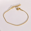 Detailed shot of golden snake bone chain with secure lobster clasp and extender - Gold Round Snake Chain 1mm (16+2cm)