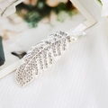 Detailed macro view of a silver feather hair clip with sparkling rhinestones and a white pearl - Silver Feather (S223-6)