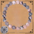 Bracciale in pietre rosa e grigie con ciondolo a bussola in argento su carta regalo - Bracciale in Pietra Zebra Rosa
