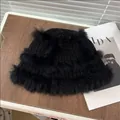 Winter black knit bucket hat with plush faux fur trim on a rustic wooden background - Rabbit Fur Bucket-Black