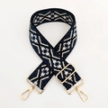 Close-up of ethnic jacquard strap with blue diamond pattern and gold metal hardware - Dark Blue Beige Floral