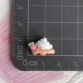 Macro detail of a resin strawberry cream waffle charm showing size on a scale mat - Mini Strawberry Cream