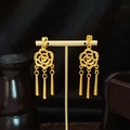 Bohemian gold rose hollow earrings with cylindrical tassel pendants on display - Gold Rose Hollow Dangle