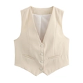 Vue détaillée du gilet beige à col en V avec quatre boutons et poches décoratives - Blanc Cassé