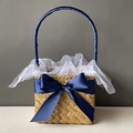 Detail of square seagrass basket with blue ribbon bow and white decorative mesh - Navy Blue Half Wrap Style
