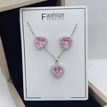 Detail of pink heart-shaped zircon jewelry set on a white display card in a gift box - Silver Color Pink Zirconia