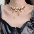 Multi-layer pearl necklace with golden heart pendant and red enamel detail on model - Multi-Layer Pearl Heart Pendant Necklace (DX0379) / Gold Red