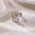 Polished silver stainless steel open ring featuring a bold cutout letter G design - Letter G / Silver