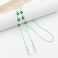 Green beaded glasses chain featuring sunflower charms and white silicone loops - Boho Flower Light Green