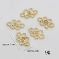 Detailed view of five golden infinity knot alloy charms for DIY jewelry making - Chinese Knot/Infinity Symbol Style (9#)