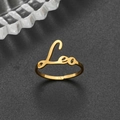 Detail of 18K gold stainless steel ring featuring Leo zodiac lettering and open design - Adjustable Open / Leo Gold