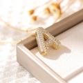 Gold-plated necklace with sparkling cubic zirconia letter A pendant on a soft background - Letter A (18k Gold + Bead Chain)