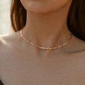 Close-up of a French vintage gold necklace with diamond chain links on a model's neck - 18K Gold