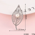Silver leaf brooch with white rhinestones and a central pearl, size 53mm by 23.5mm - D1000 Rhinestone Leaf