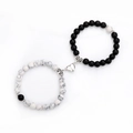 Detail of magnetic heart clasp connecting white marble and matte black beaded bracelets - Howlite Black Matte White K Heart