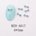 Detailed view of silver alloy 3D blue bow nail charms with rhinestones 6x3mm - Light Blue Faux Crystal Bow (A617)
