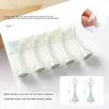 Macro detail of acrylic nail tip holders with heart top and magnetic base for practice - Aurora Translucent White Style (JT-09)