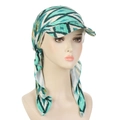 Detail of teal and yellow geometric pattern on a stylish tied turban sun hat - Green Rhombus