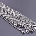 Macro shot of 2mm stainless steel bead and link chains with S.STEEL engraved clasps - Silver