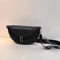 Modern black crescent crossbody bag with lychee texture and adjustable wide nylon strap - Black