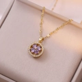 Macro detail of gold flower pendant with purple heart-shaped zircons and white stones - Gold Purple Heart Rotating Necklace (X0724-4)