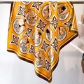 Detail of yellow silk scarf showing floral patterns and rabbit print draped on a rod - Bright Yellow Retro Rabbit Pattern (FN130-2)