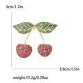 Fashion cherry brooch with red and green cubic zirconia stones on gold plating - Purple