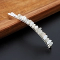 Elegant silver metal hair clip featuring natural white crystal stones on wooden stand - White Moonstone with Silver Clip