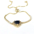 Close-up of heart-shaped dark blue gemstone bracelet with adjustable gold slider chain - Dark Blue